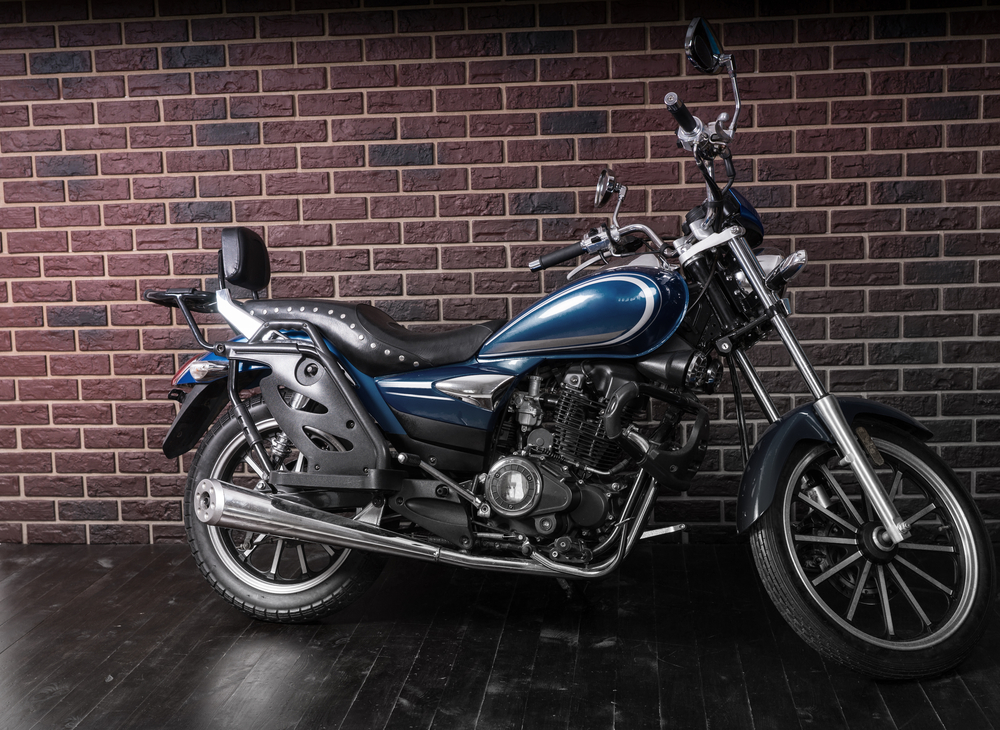 Full,length,profile,of,blue,standard,cruiser,style,motorcycle,in