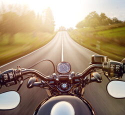 Pov,shot,of,young,man,riding,on,a,motorcycle.,hands
